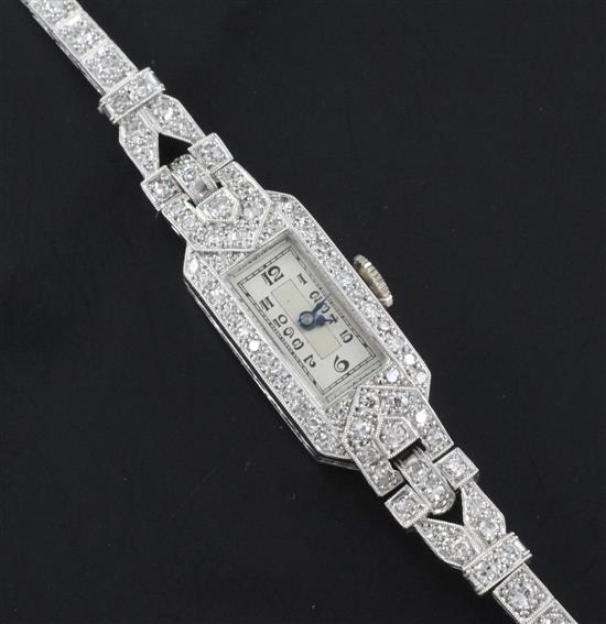 A 1930s/1940s platinum and diamond set Crusader manual wind cocktail watch, 6.25in.